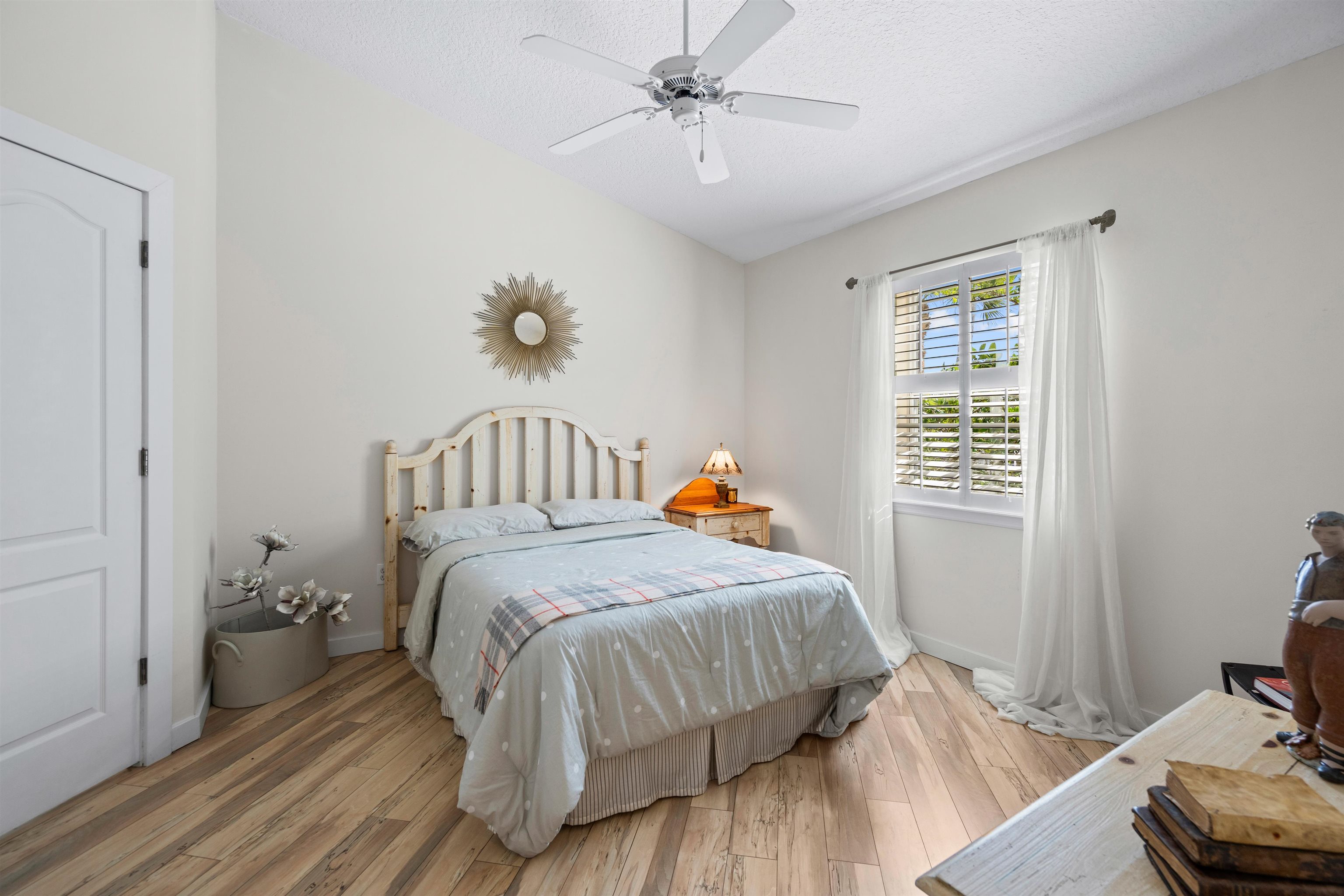 9244 July Lane St. Augustine, FL 32080 - Photo 24 of 66 a bedroom with a bed and wooden floor