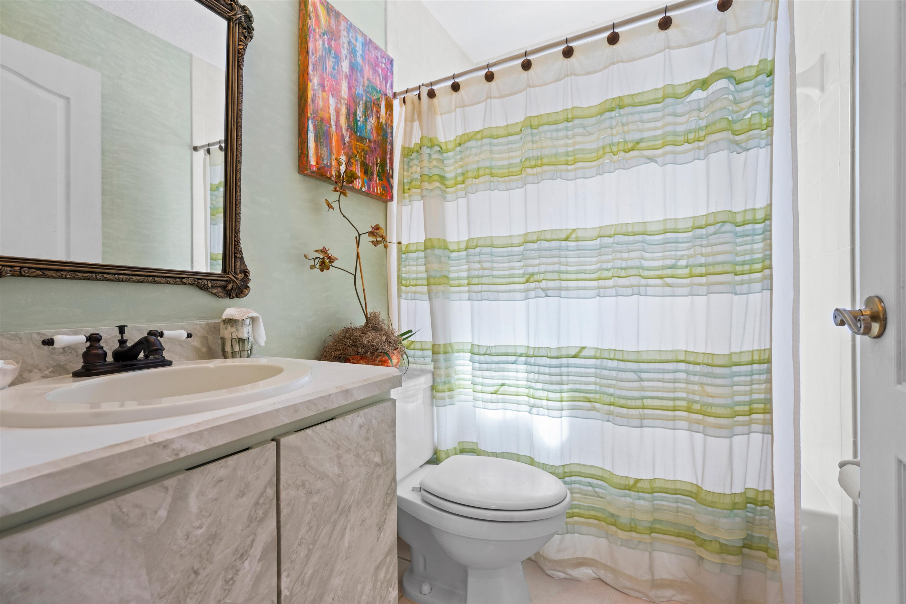 9244 July Lane St. Augustine, FL 32080 - Photo 26 of 66 a bathroom with a sink toilet and shower