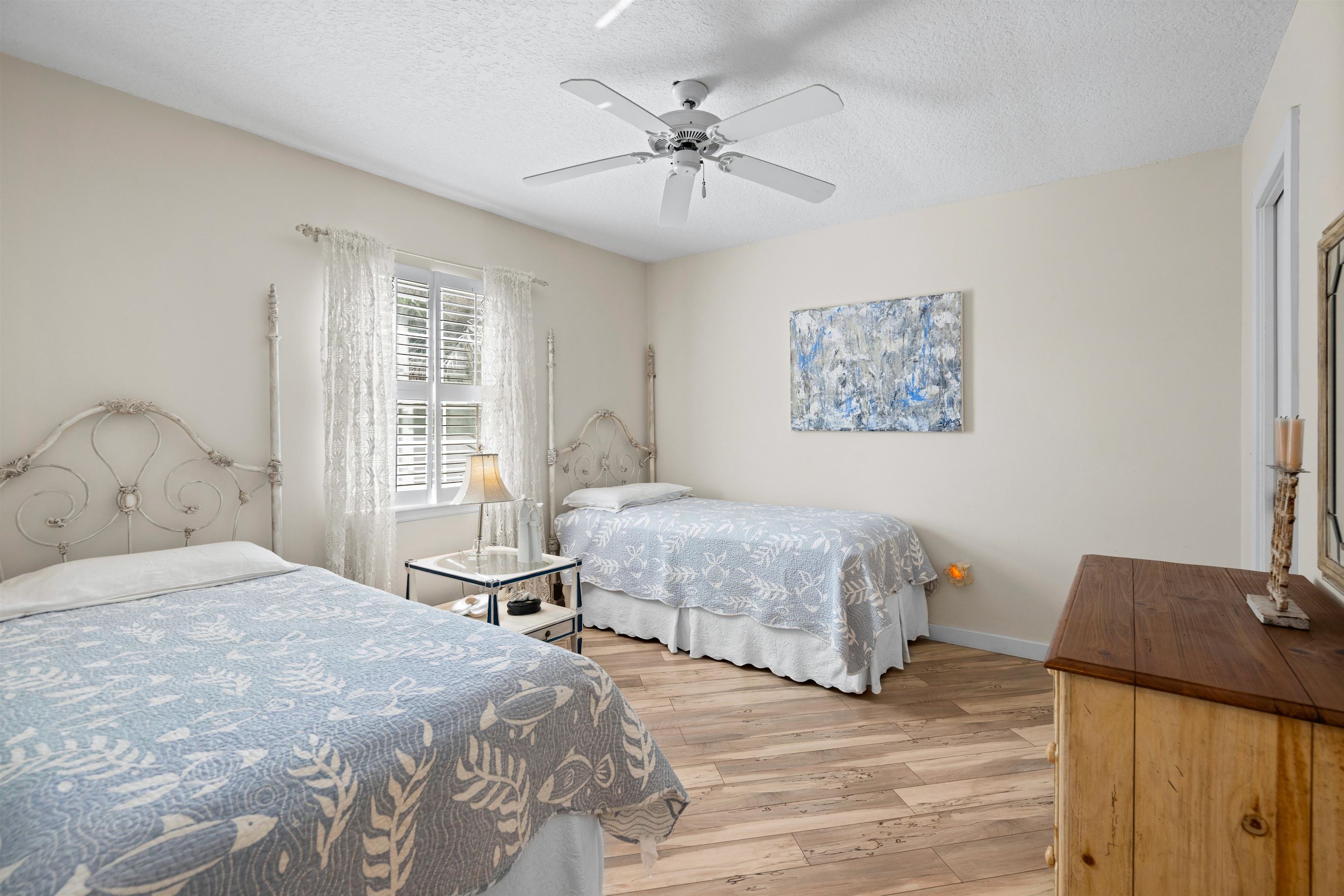9244 July Lane St. Augustine, FL 32080 - Photo 27 of 66 a bedroom with a bed and a table with closet