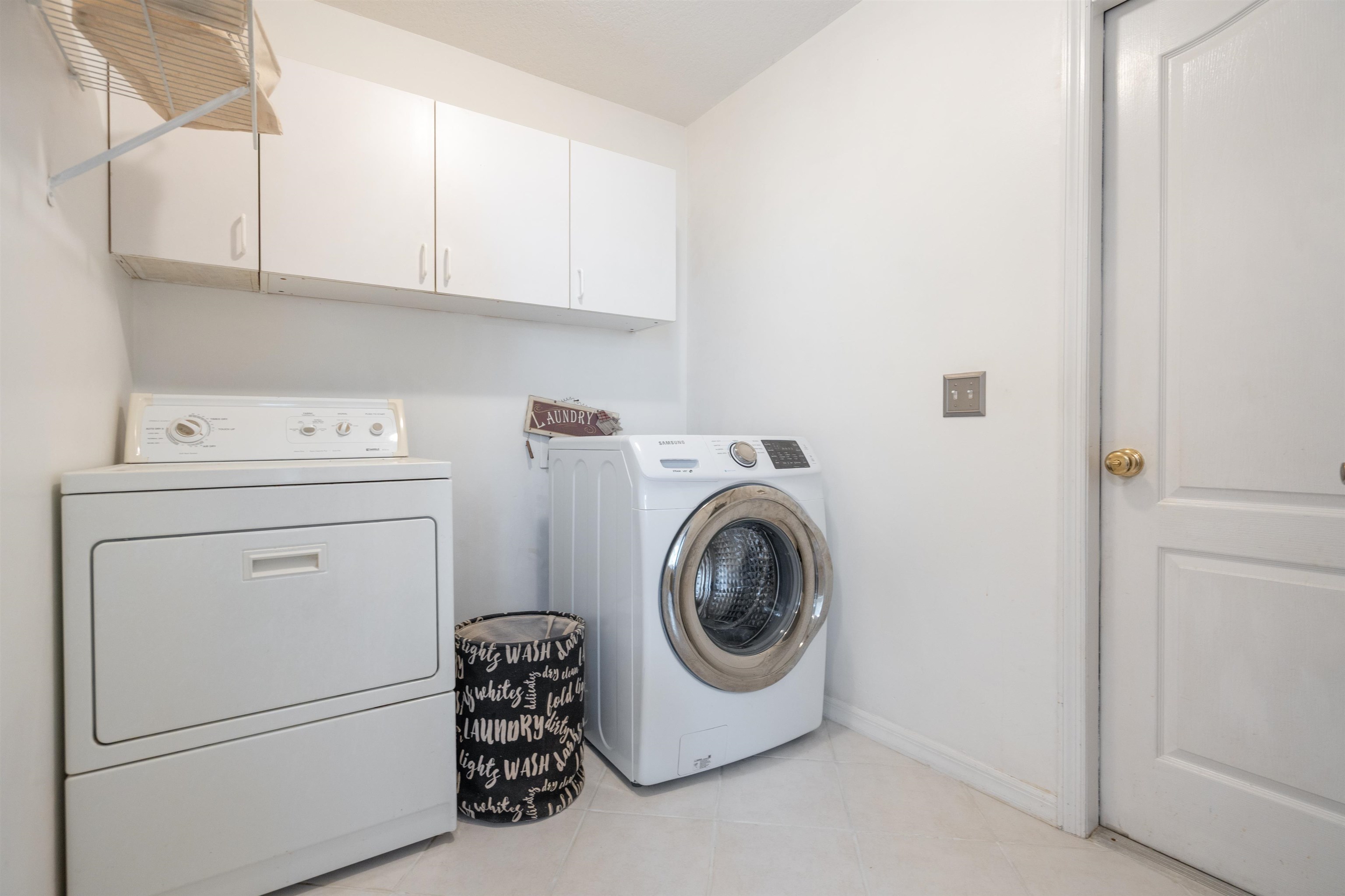 9244 July Lane St. Augustine, FL 32080 - Photo 29 of 66 a utility room with dryer and washer