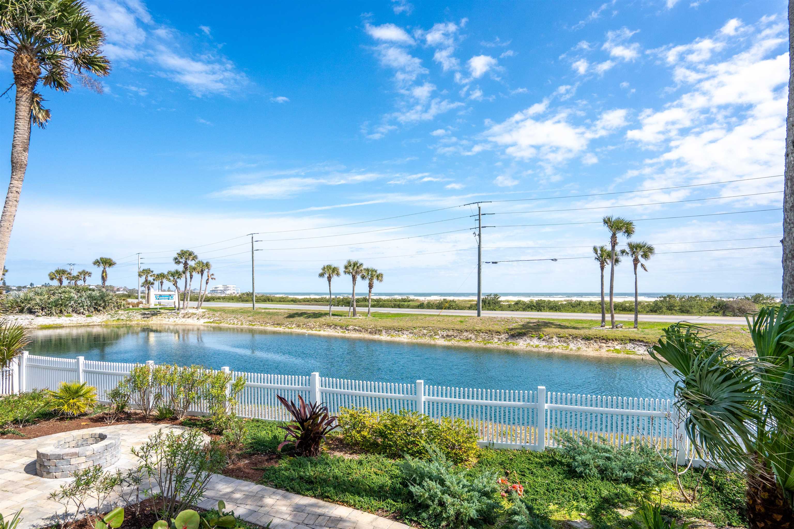 9244 July Lane St. Augustine, FL 32080 - Photo 37 of 66 a view of a swimming pool with an ocean view