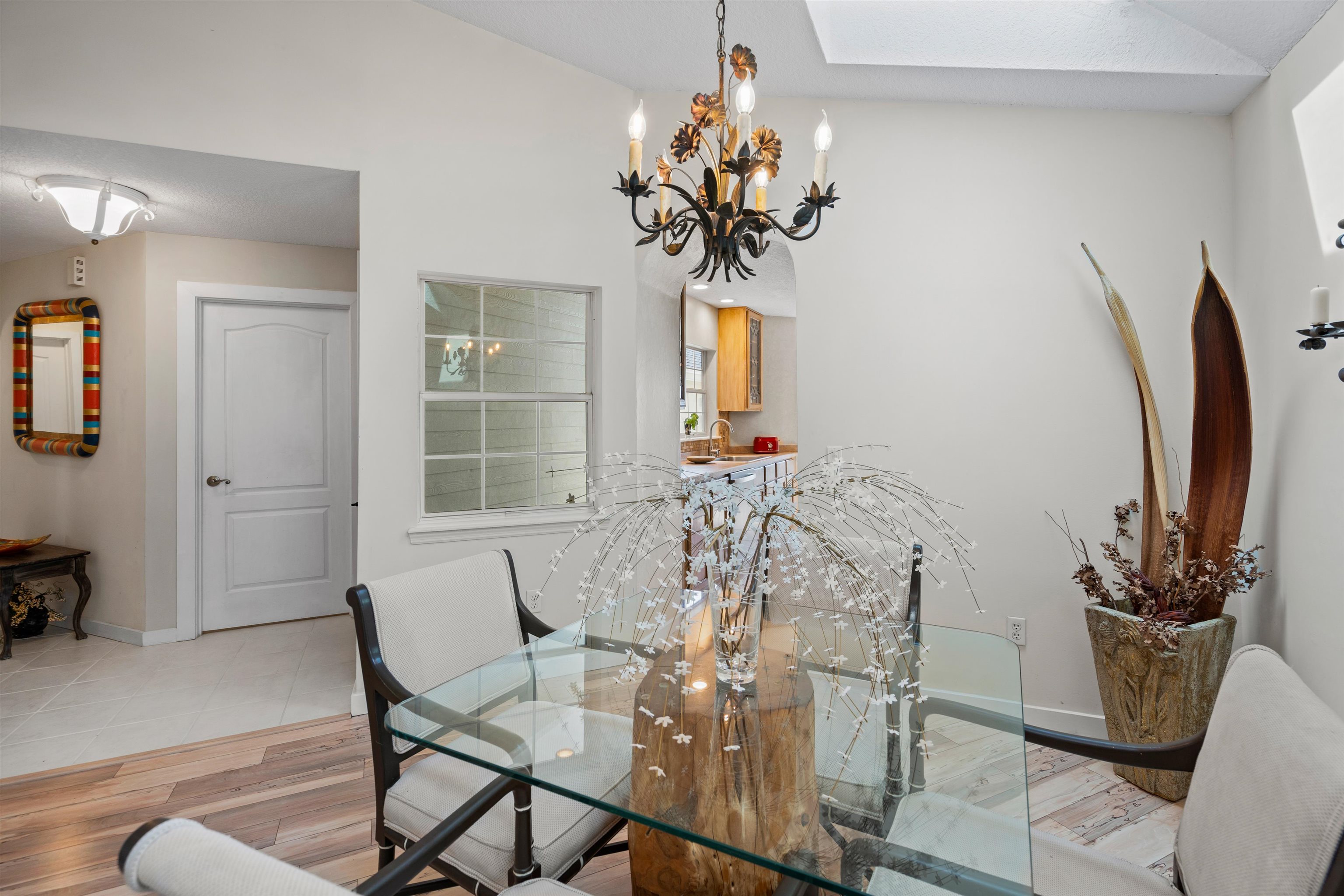 9244 July Lane St. Augustine, FL 32080 - Photo 5 of 66 a view of a dining room with furniture and a potted plant