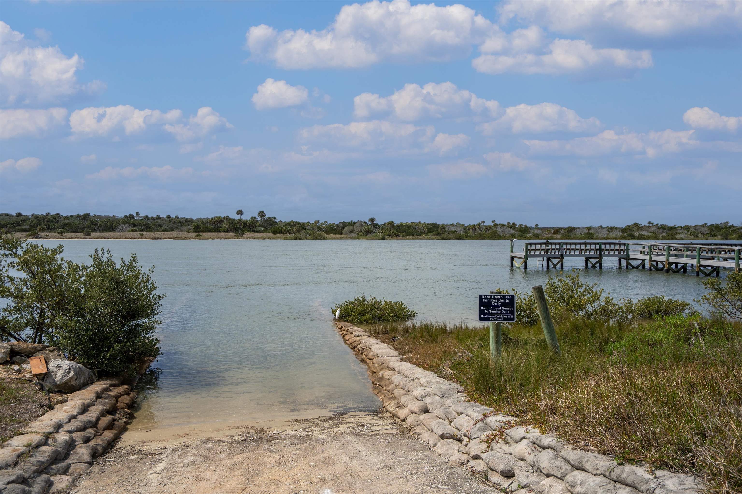 9244 July Lane St. Augustine, FL 32080 - Photo 52 of 66 a view of a lake with houses in the back