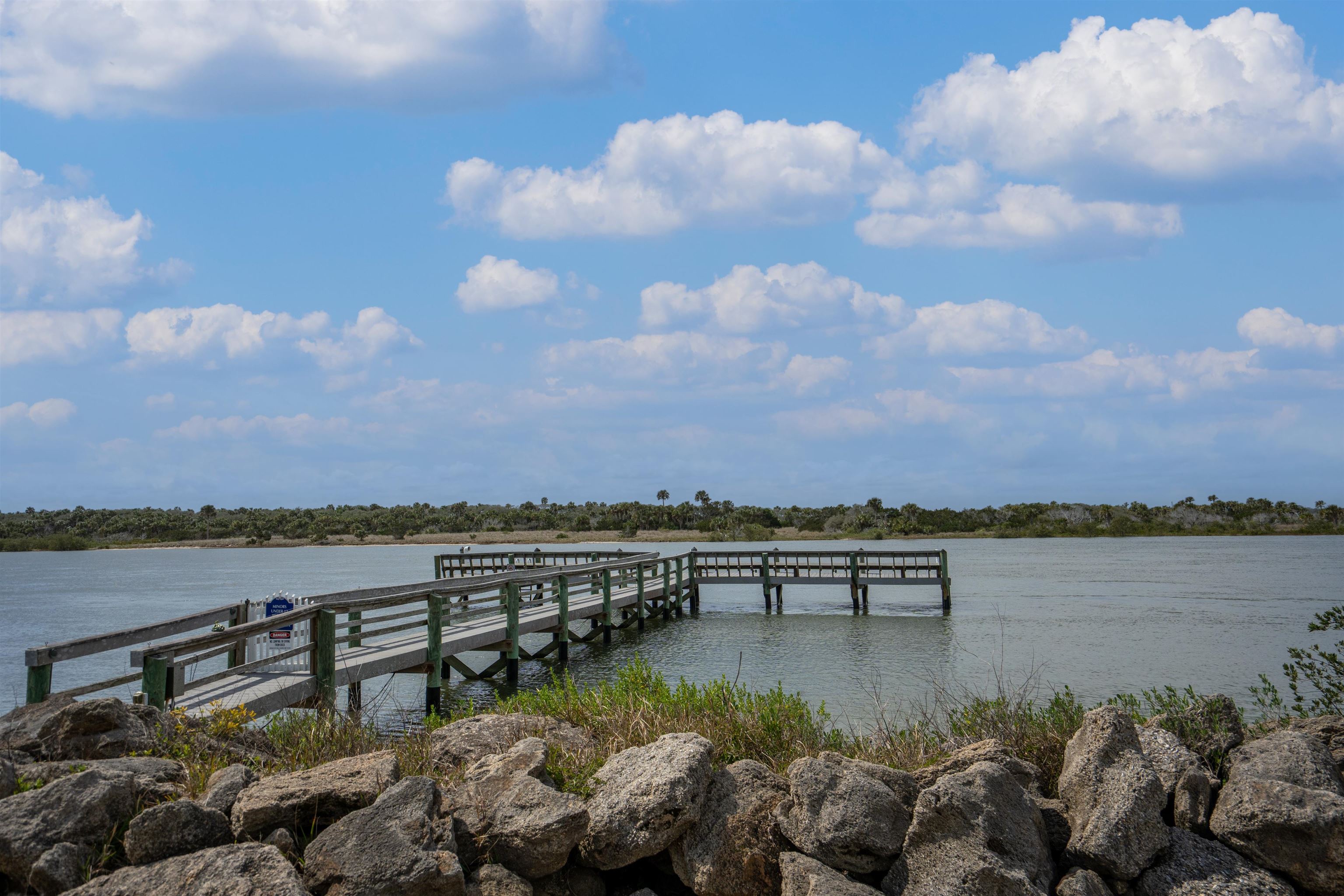 9244 July Lane St. Augustine, FL 32080 - Photo 53 of 66 a view of a lake with houses in the back