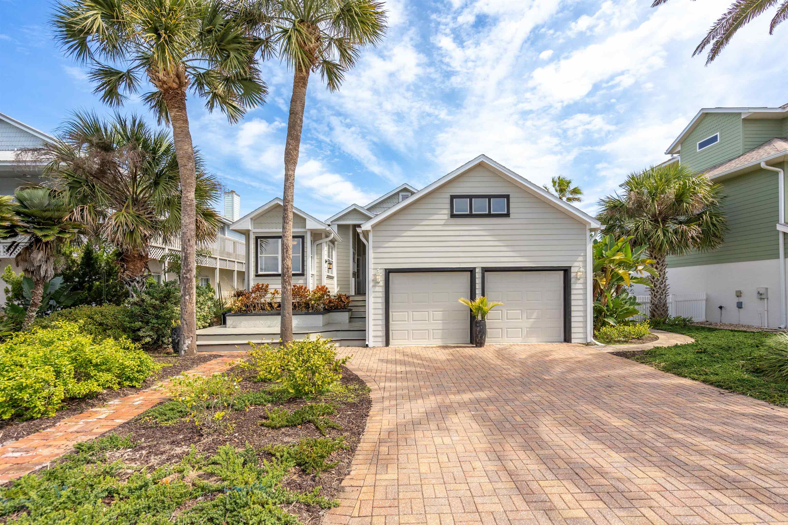 9244 July Lane St. Augustine, FL 32080 - Photo 66 of 66 a front view of a house with a yard