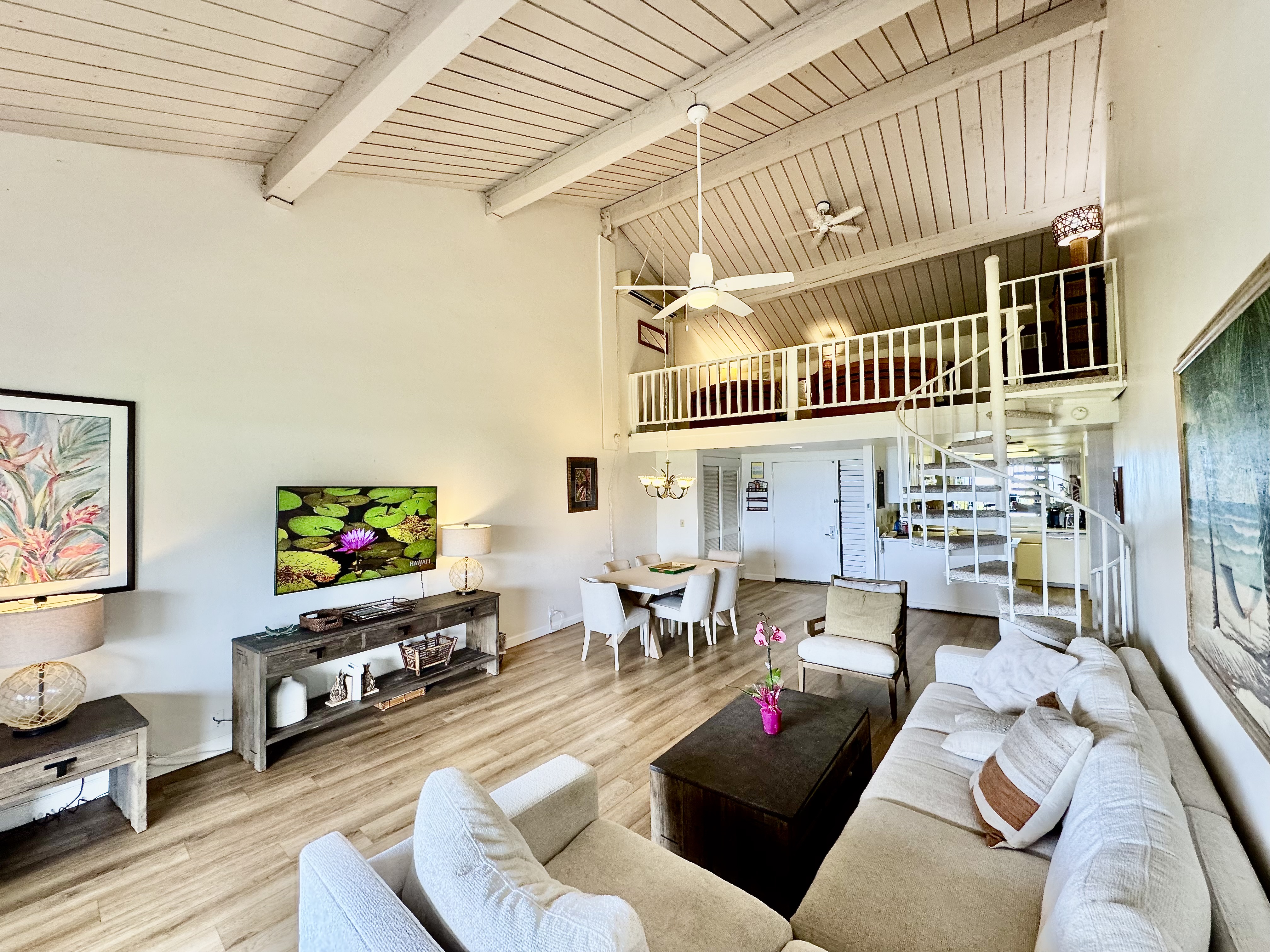 5380 Honoiki Road, Unit J33 Princeville, HI 96722 - Photo 16 of 30 a living room with furniture and a flat screen tv