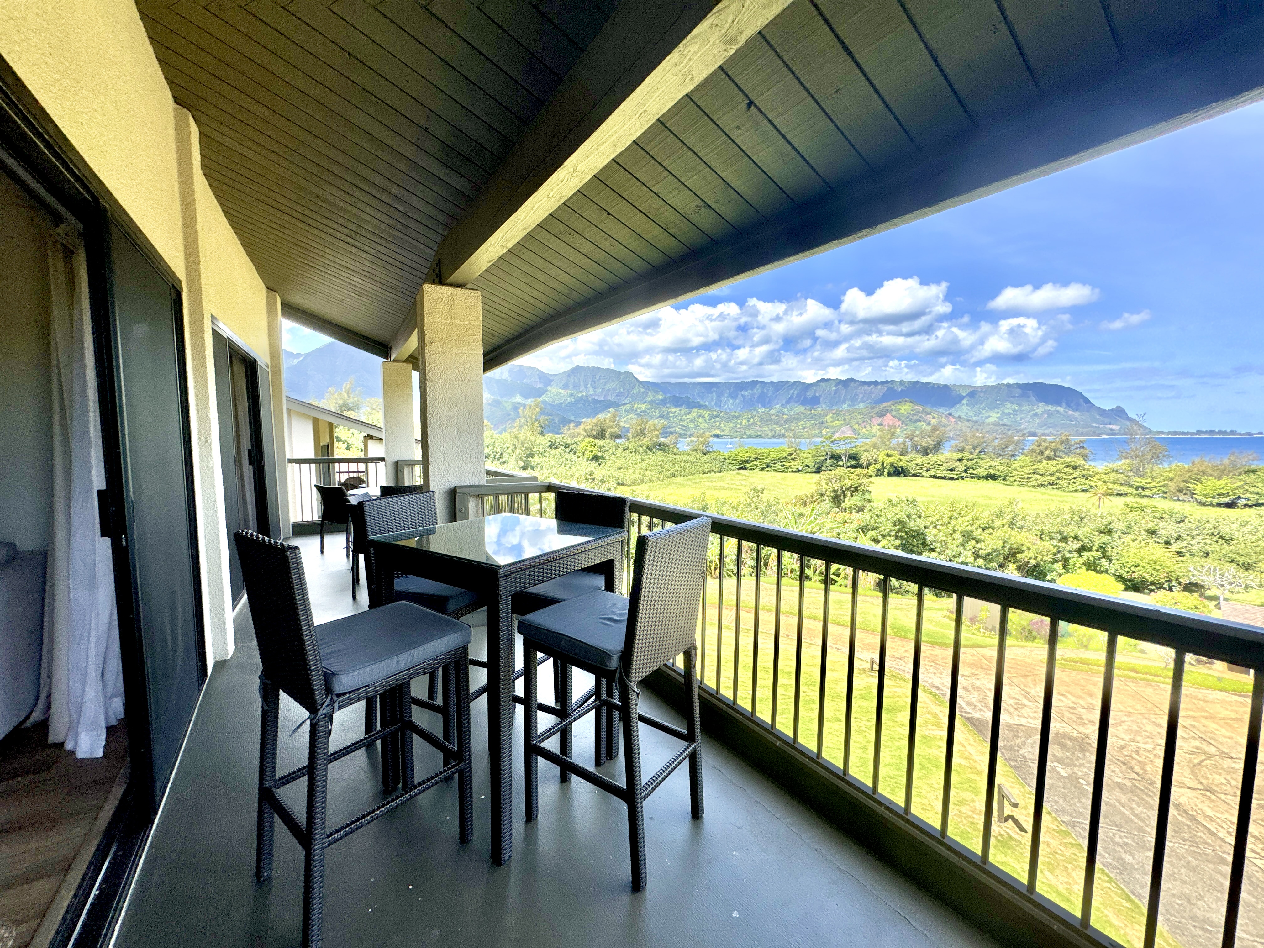 5380 Honoiki Road, Unit J33 Princeville, HI 96722 - Photo 2 of 30 a view of a chairs and table in the balcony