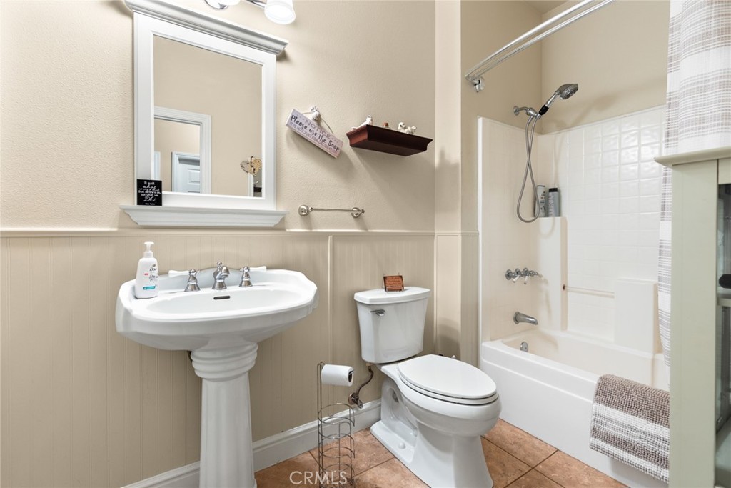 6341 Amherst Way Magalia, CA 95954 - Photo 14 of 28 a bathroom with a sink toilet and shower