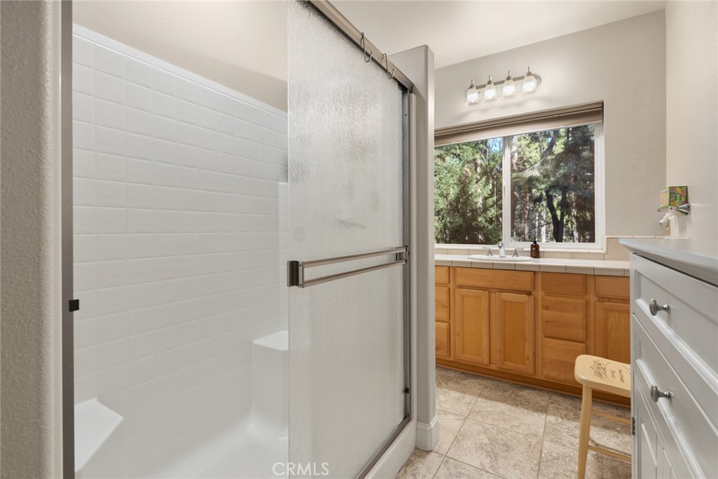 6341 Amherst Way Magalia, CA 95954 - Photo 16 of 28 a bathroom with a sink and a mirror