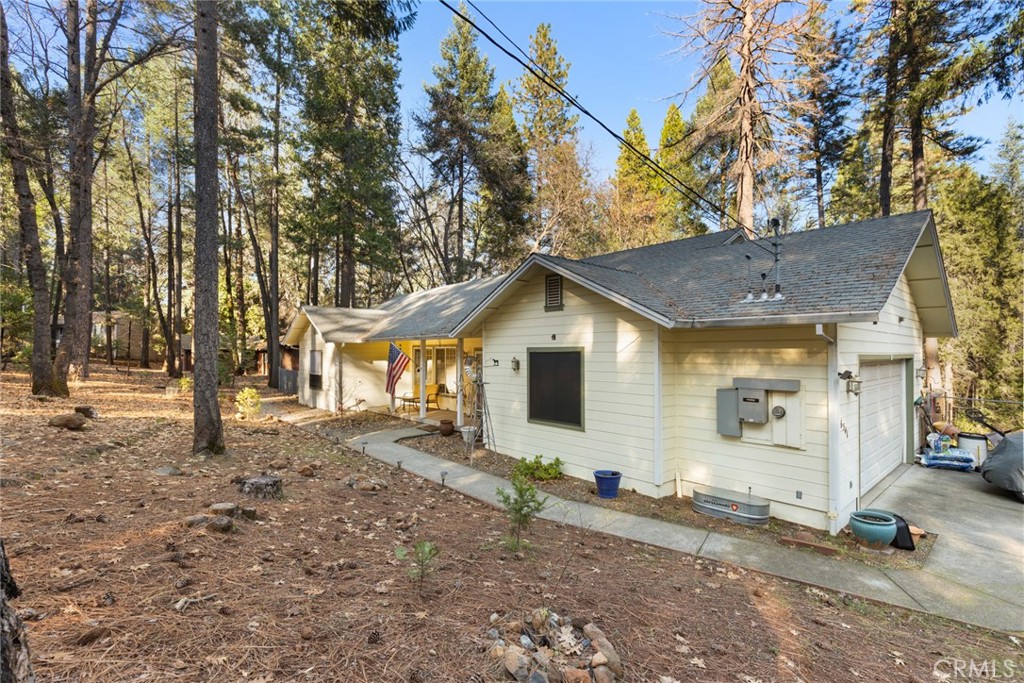 6341 Amherst Way Magalia, CA 95954 - Photo 19 of 28 a view of a house with a yard covered in snow