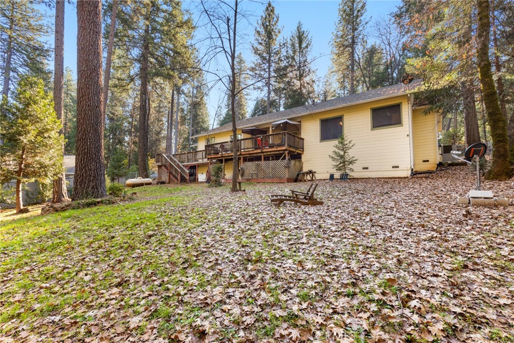 6341 Amherst Way Magalia, CA 95954 - Photo 21 of 28 a backyard of a house with barbeque oven table and chairs