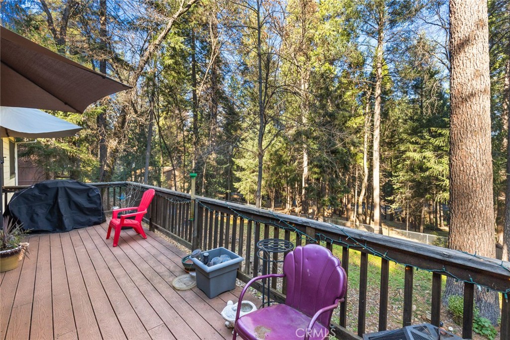 6341 Amherst Way Magalia, CA 95954 - Photo 22 of 28 a view of a deck with wooden floor and outdoor seating