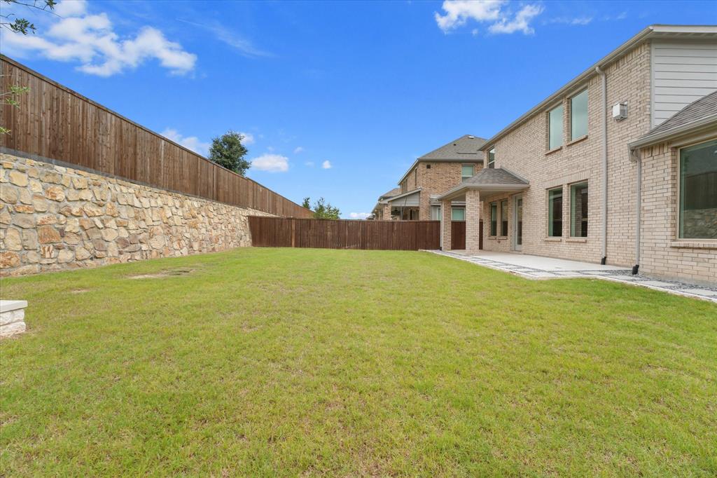 3533 Hyacinth Way Prosper, TX 75078 - Photo 30 of 38 a view of a house with a big yard