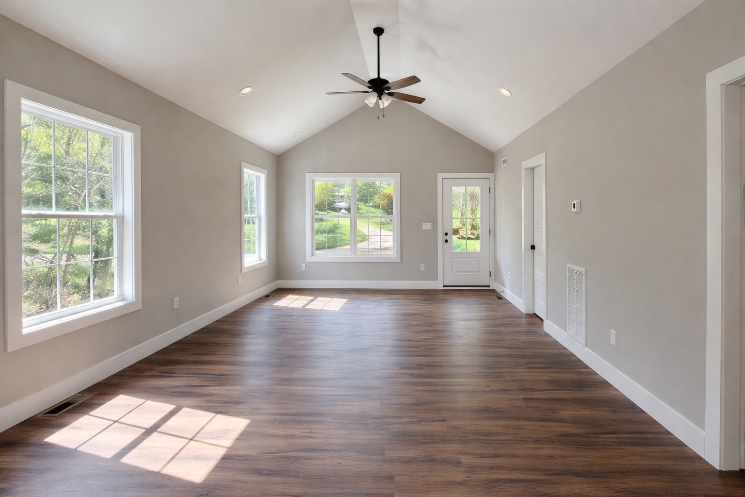 397 Hightower Road Elkton, KY 42220 - Photo 2 of 7 a view of an empty room with wooden floor and a window