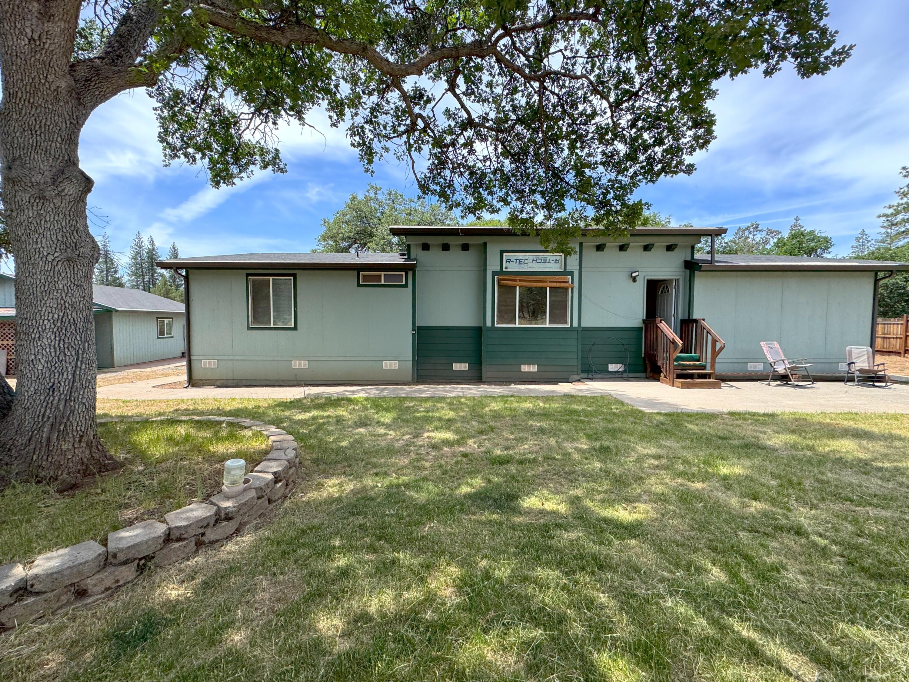 29093 Day Road McArthur, CA 96056 - Photo 1 of 39 a house view with a garden space