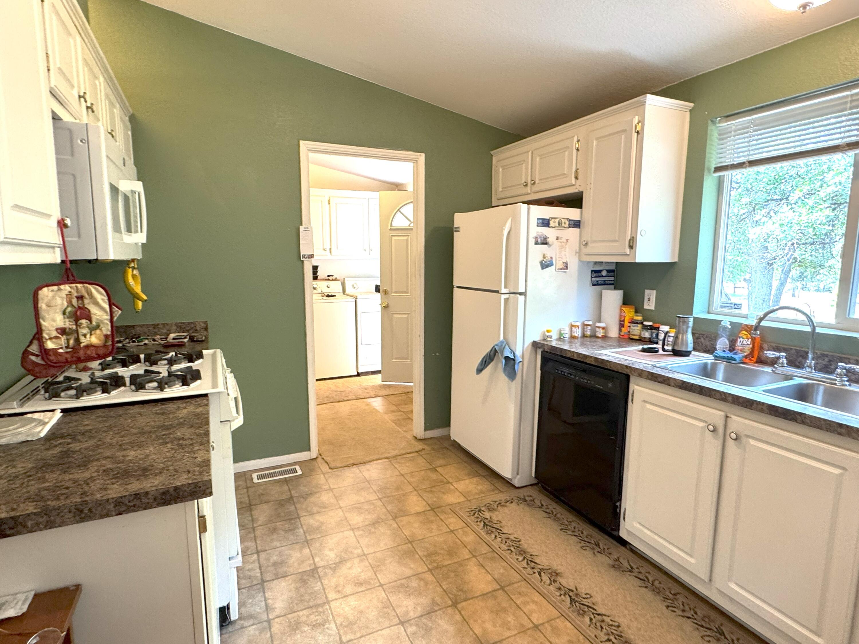 29093 Day Road McArthur, CA 96056 - Photo 17 of 39 a kitchen with a refrigerator stove and sink