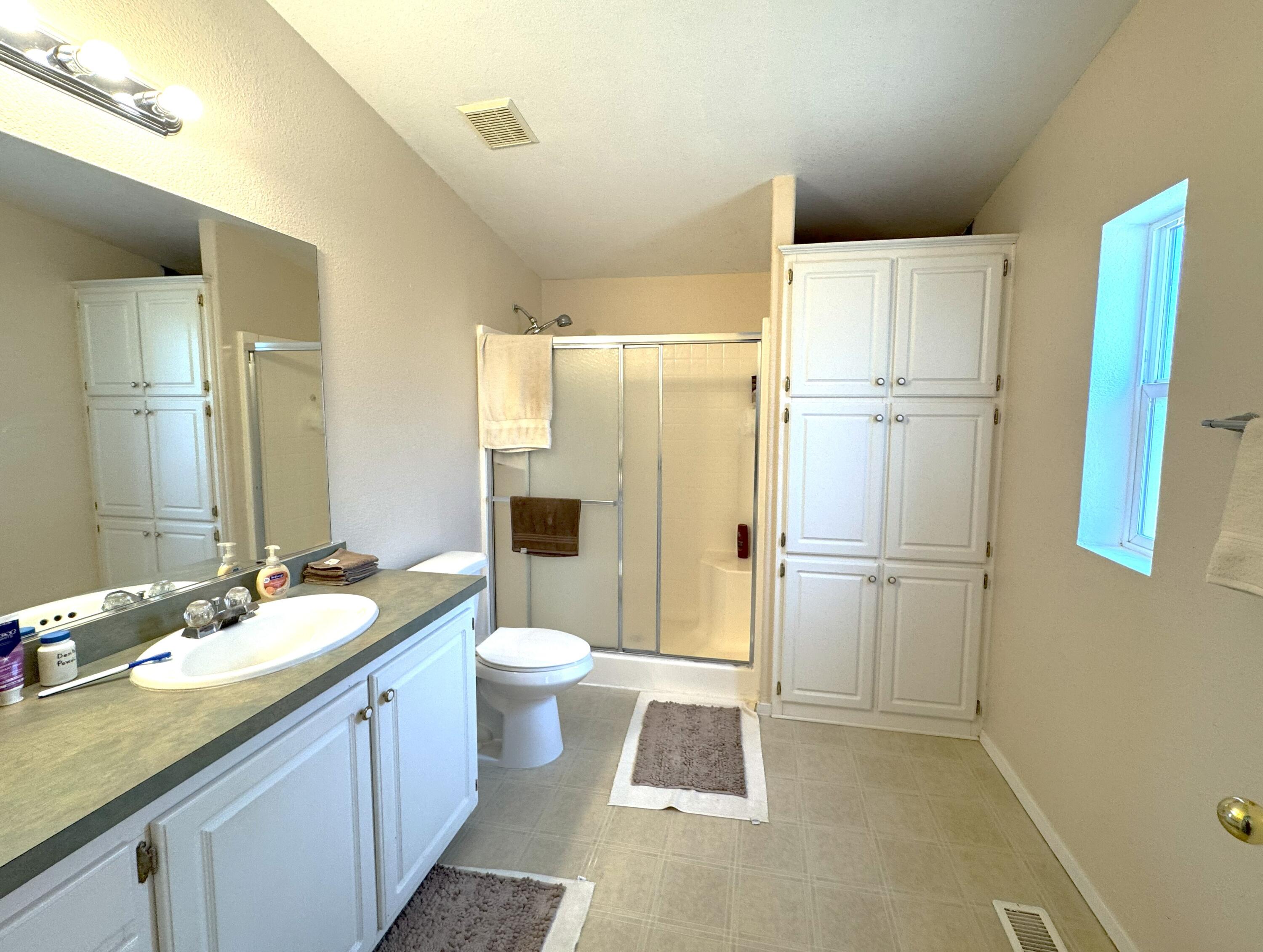 29093 Day Road McArthur, CA 96056 - Photo 20 of 39 a bathroom with a granite countertop sink toilet and shower