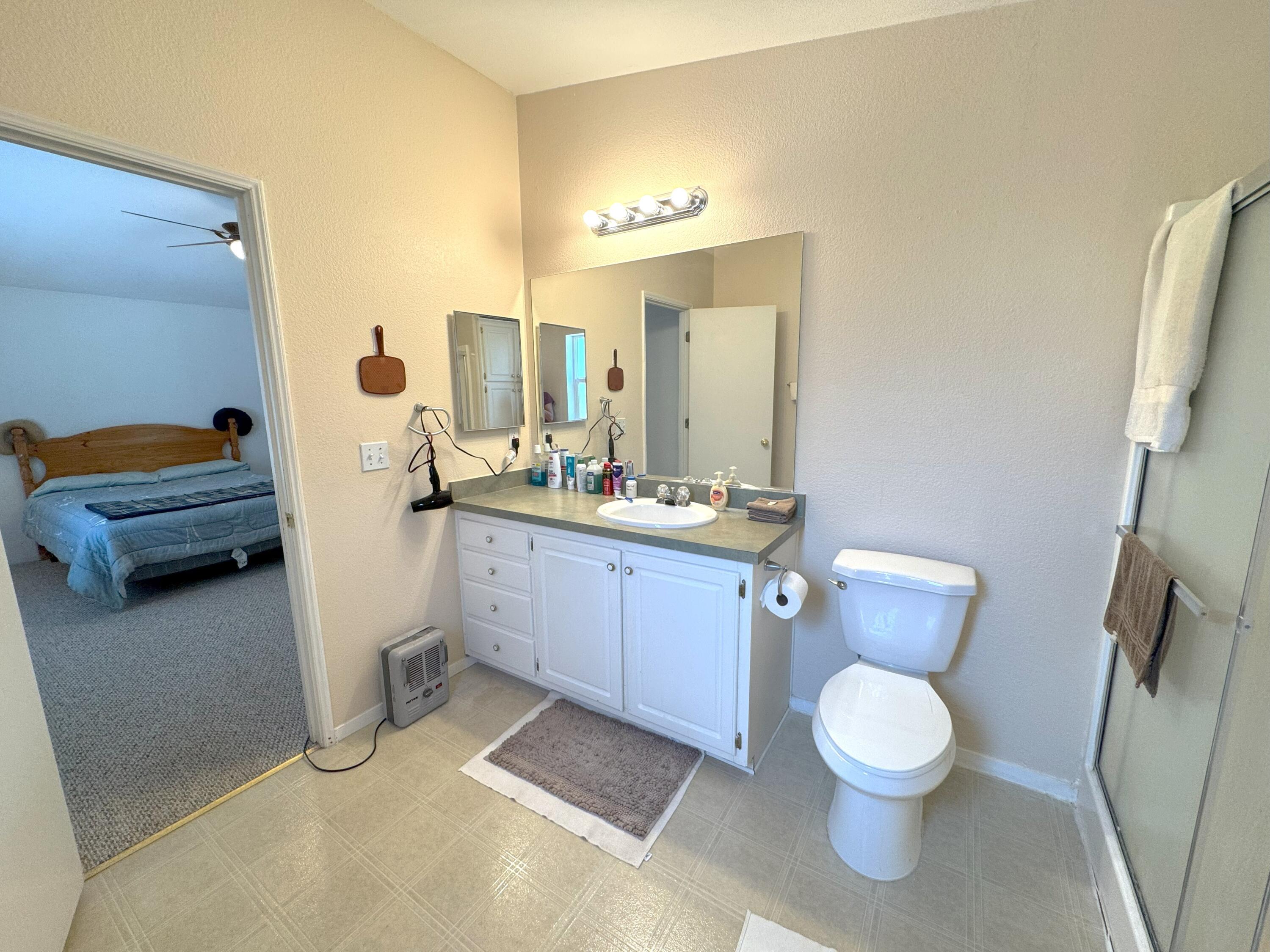 29093 Day Road McArthur, CA 96056 - Photo 21 of 39 a bathroom with a toilet sink and mirror
