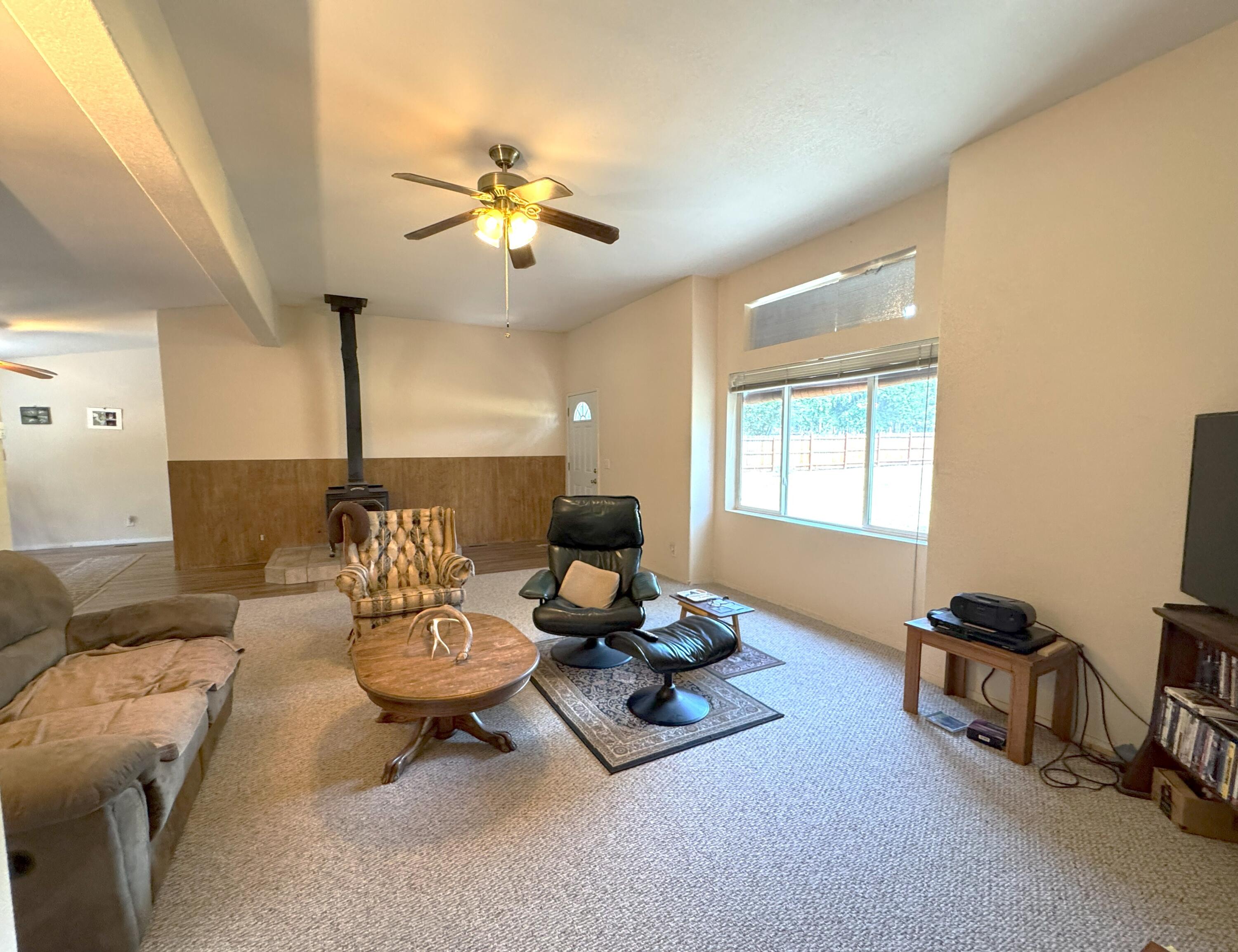 29093 Day Road McArthur, CA 96056 - Photo 10 of 39 a living room with furniture a chandelier and a window