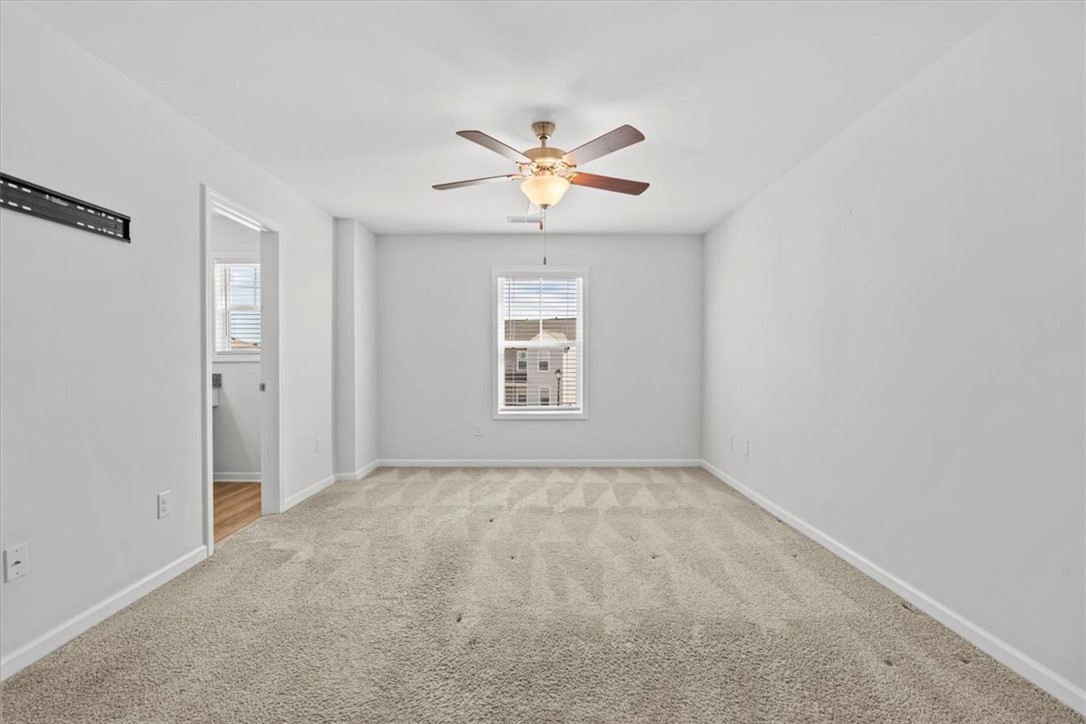 118 Adger Road Pendleton, SC 29670 - Photo 18 of 31 This bright and airy room offers a comfortable retreat with soft carpeting.