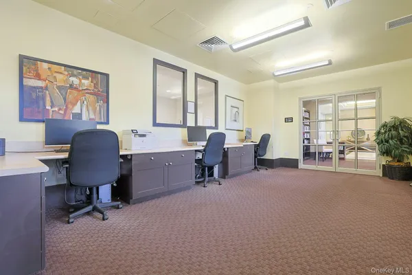 a workspace with furniture and a window