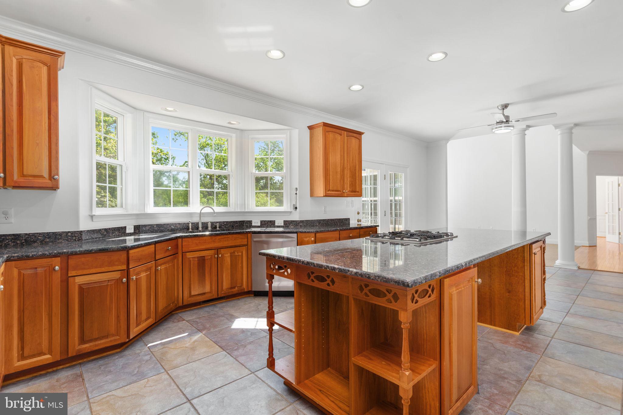 70 Sentinel Ridge Lane Stafford, VA 22554 - Photo 15 of 53 a kitchen with stainless steel appliances granite countertop a stove a sink and a refrigerator