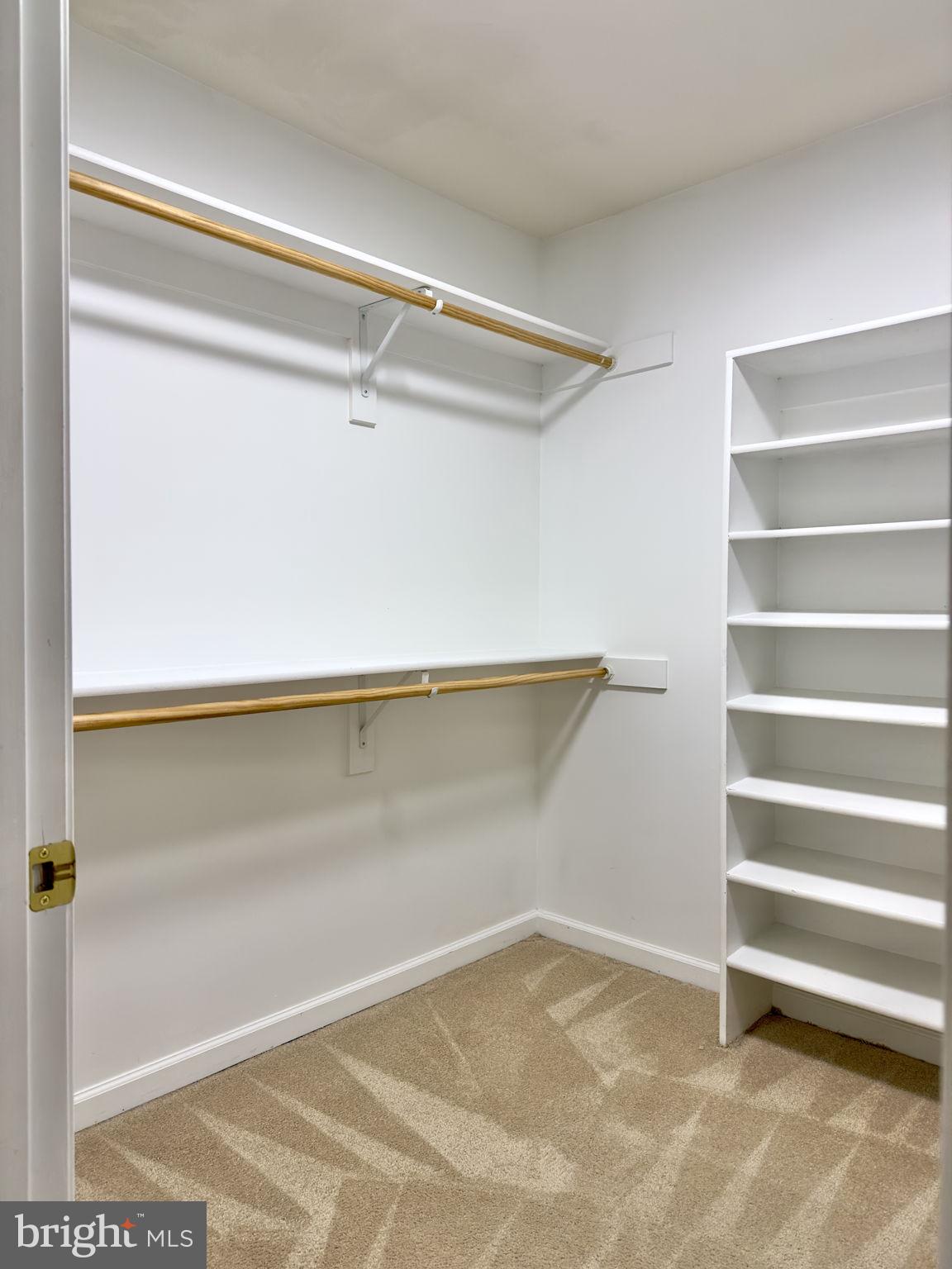 70 Sentinel Ridge Lane Stafford, VA 22554 - Photo 26 of 53 a view of walk in closet with empty racks