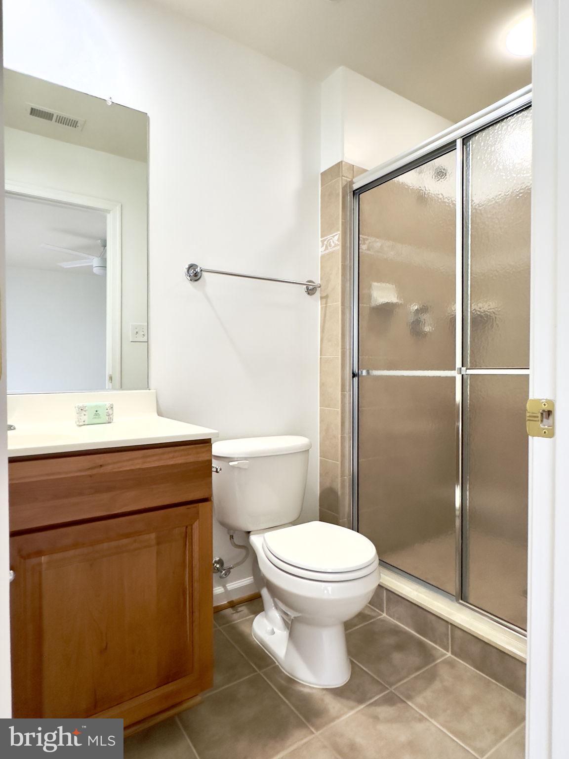 70 Sentinel Ridge Lane Stafford, VA 22554 - Photo 31 of 53 a bathroom with a shower a toilet and a sink