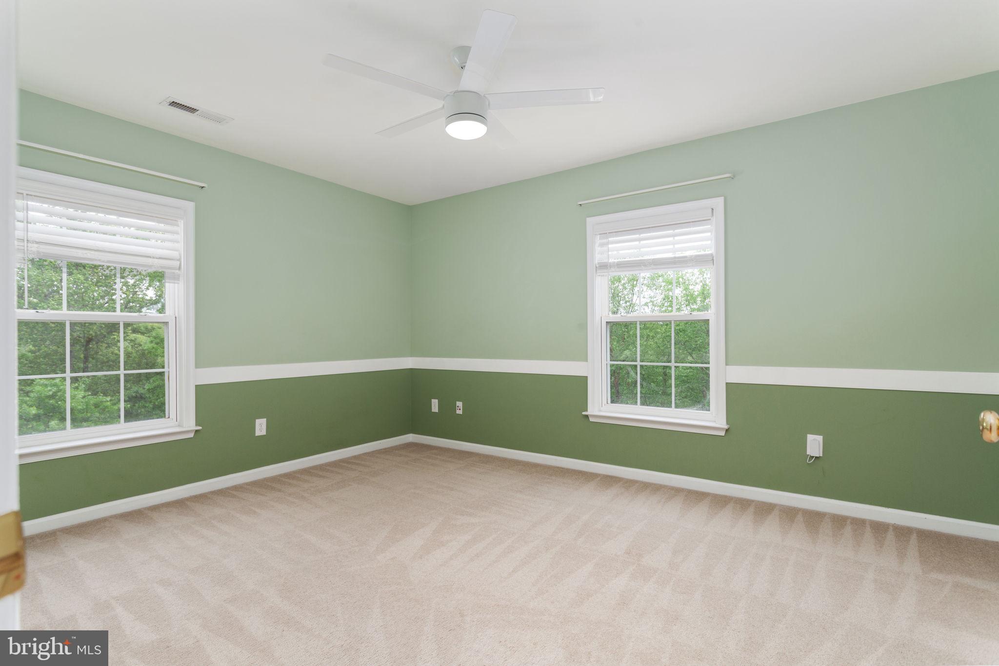 70 Sentinel Ridge Lane Stafford, VA 22554 - Photo 32 of 53 an empty room with a window and a ceiling fan