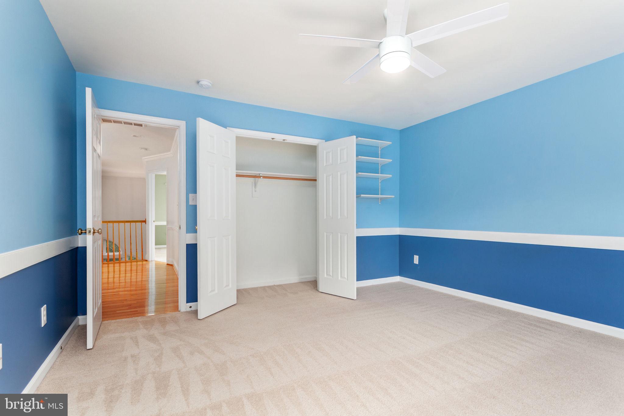 70 Sentinel Ridge Lane Stafford, VA 22554 - Photo 36 of 53 an empty room with closet and a chandelier fan