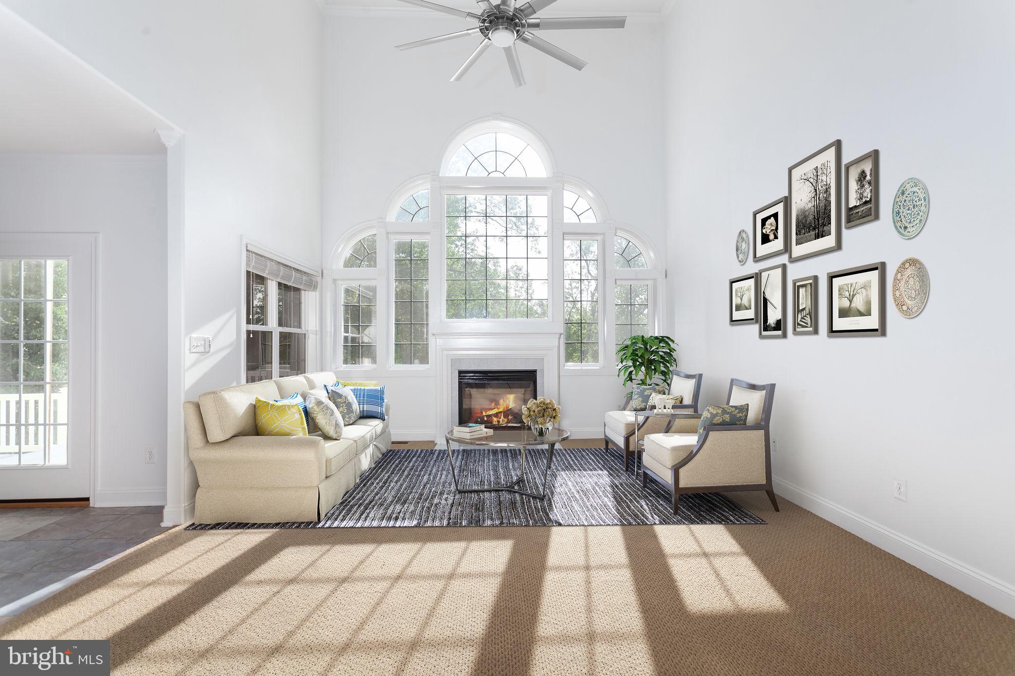 70 Sentinel Ridge Lane Stafford, VA 22554 - Photo 7 of 53 a living room with furniture a fireplace and a chandelier