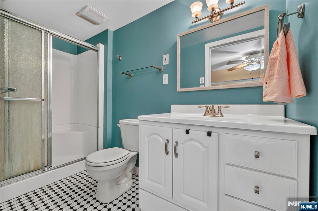 5110 Berkshire Valley Road Oak Ridge, NJ 07438 - Photo 41 of 49 a bathroom with a sink toilet and shower
