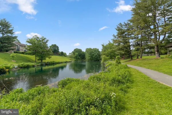a view of a lake with a house in the background