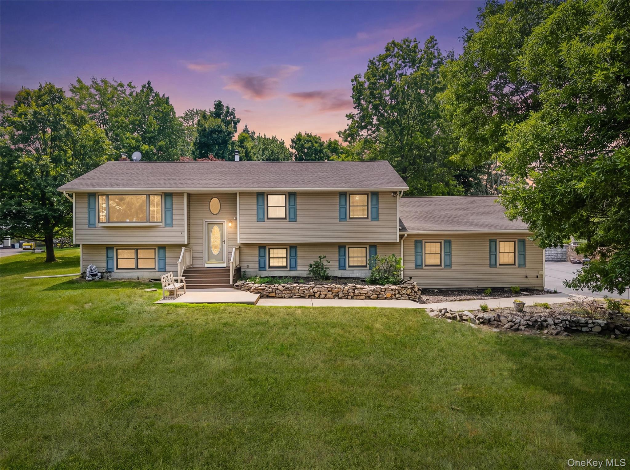 318 Beattie Road Washingtonville, NY 10992 - Photo 1 of 42 a front view of a house with a garden