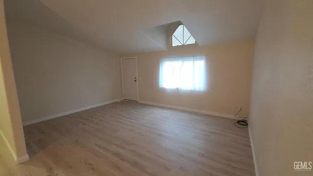 a view of an empty room and window