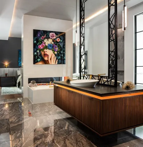 a view of a kitchen with kitchen island granite countertop a sink and a stove top oven