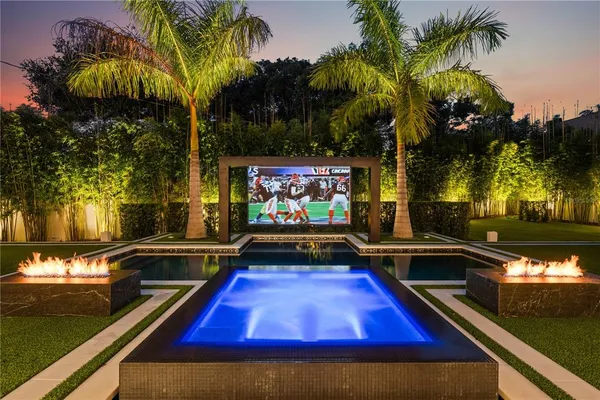 a view of swimming pool with chairs
