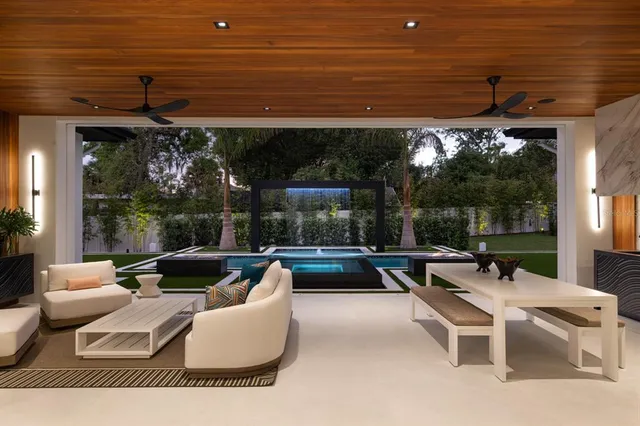 a patio with patio couch and table