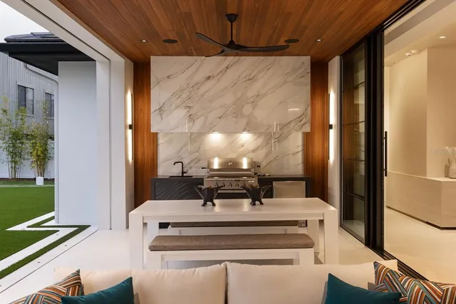 a view of a balcony with table and chairs