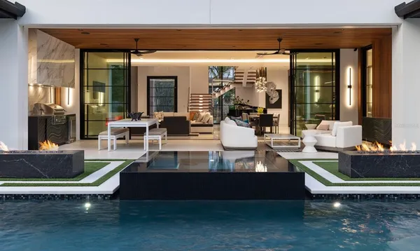 a view of living room with patio furniture and front door