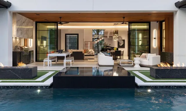 a view of living room with patio furniture and front door