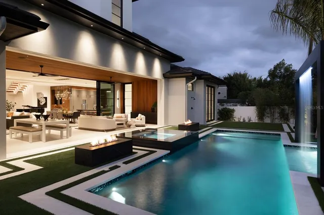 a view of swimming pool with chairs