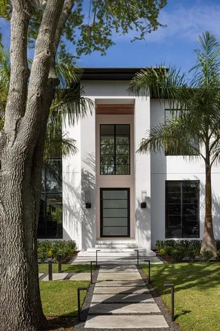 front view of a house with a garden