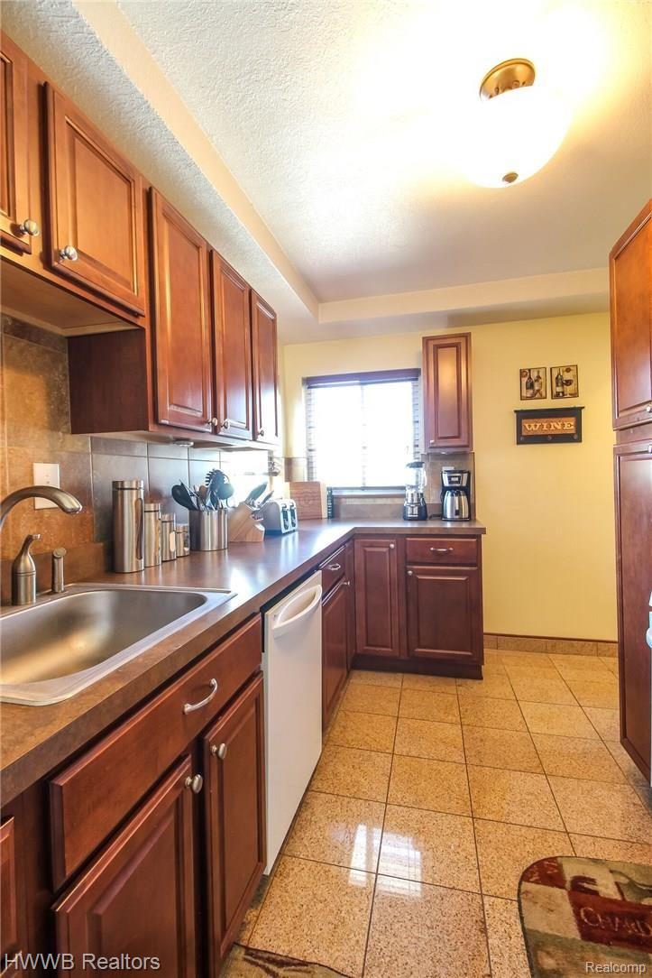 15014 Champaign Road Allen Park, MI 48101 - Photo 5 of 25 Updated cabinets, granite floor
