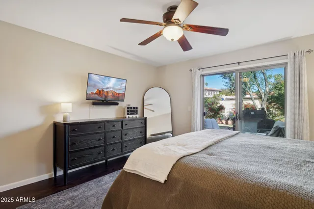 a bedroom with a large bed and a window