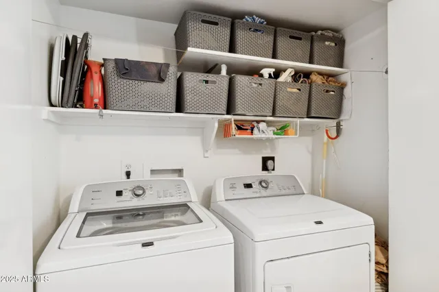 a bathroom with a sink a toilet a mirror and shower
