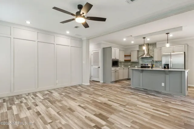 a view of kitchen with wooden floor and window
