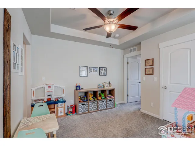 a view of a livingroom with furniture and workspace