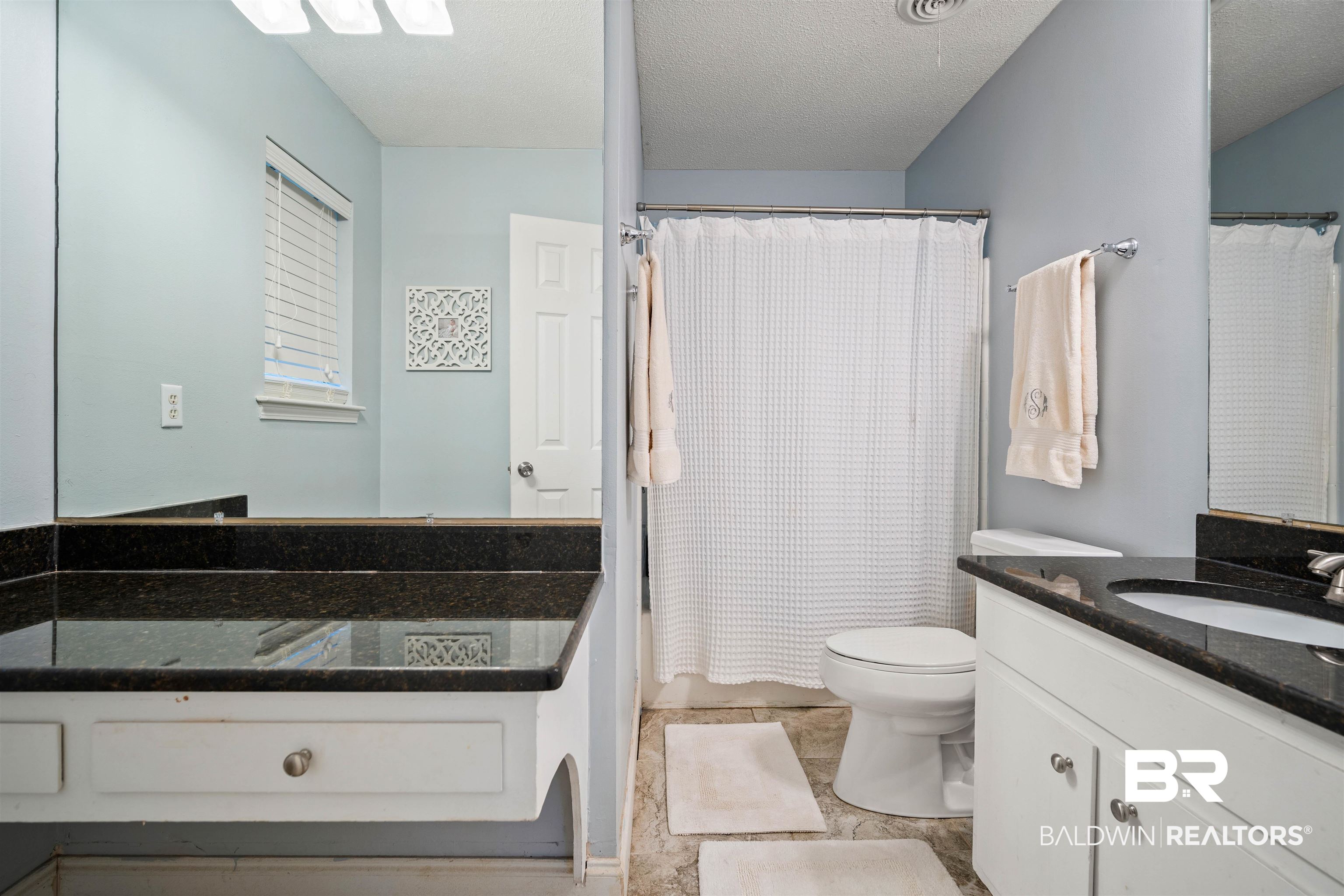 4228 Spring Valley Drive South Mobile, AL 36693 - Photo 18 of 31 Bathroom with tile patterned floors, vanity, a textured ceiling, and toilet