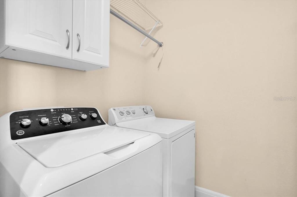 20201 Ragazza Circle, Unit 201 Venice, FL 34293 - Photo 40 of 58 a utility room with dryer and washer